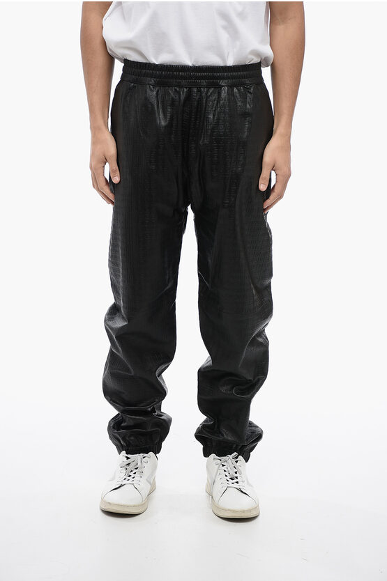 Givenchy Embossed-4g Pattern Leather Trousers In Black