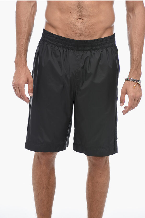 Shop Givenchy Embossed Logo Swimshorts