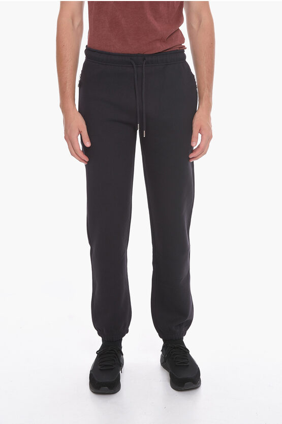 Honey Fucking Dijon Fleeced-cotton Trousers With Silver Details In Black