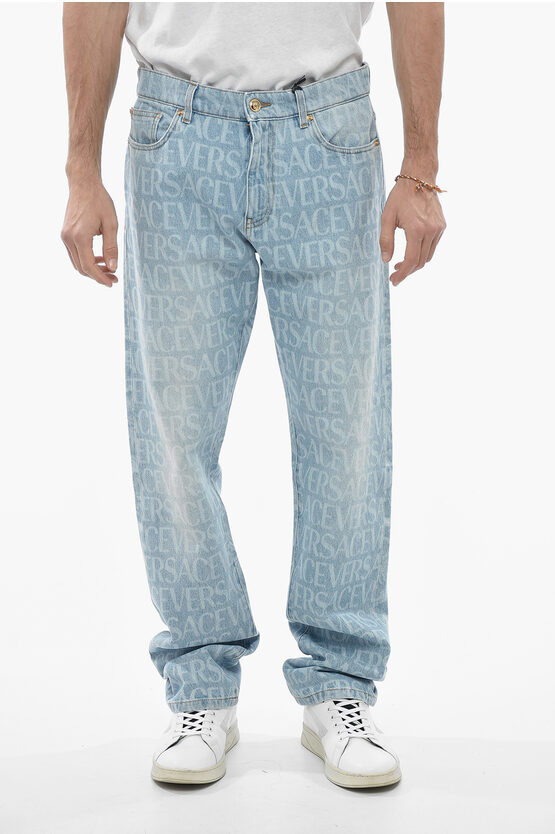 Versace Light Wash Mitchel Denims With All Over Logoed Pattern In Blue