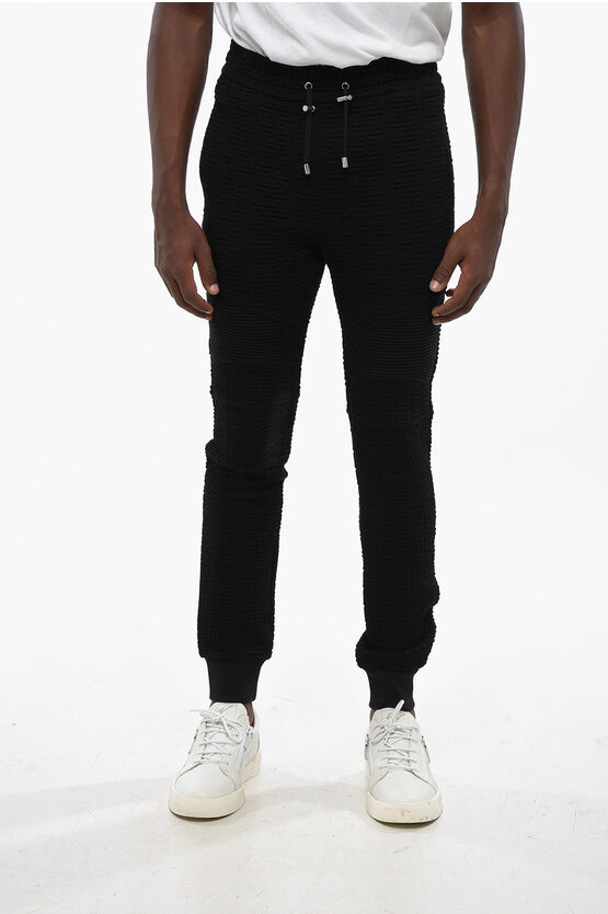 Balmain Solid Color Joggers With All-over Monogram In Black
