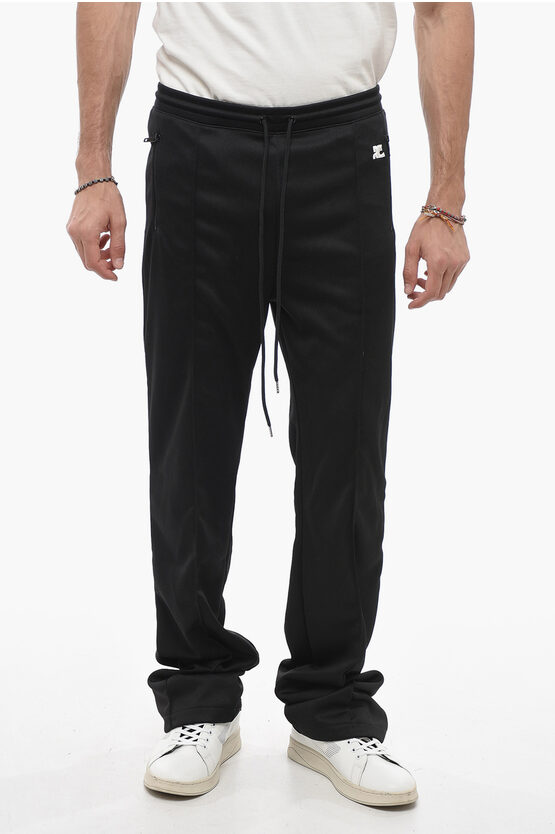 Shop Courrèges Solid Color Joggers With Contrasting Logo