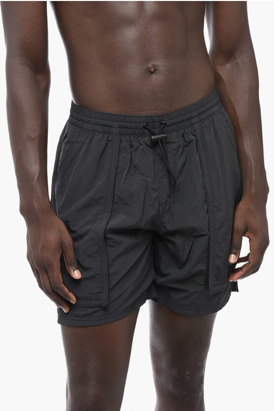 Shop Nike Solid Color Swim Shorts With 3 Pockets