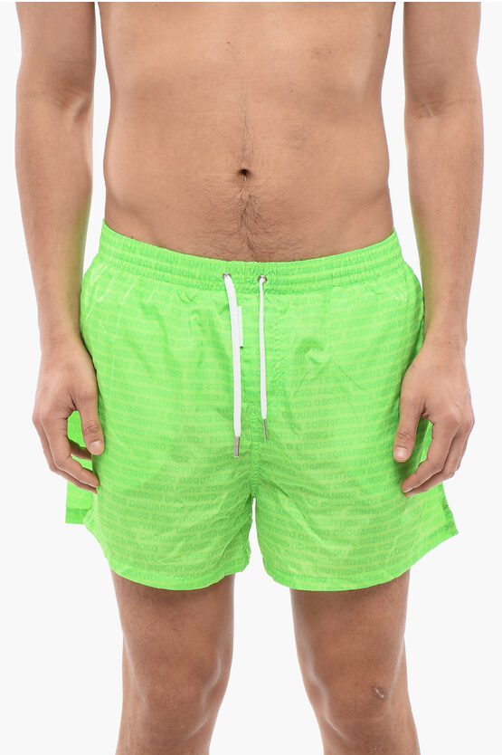 DSQUARED2 SOLID COLOR SWIM SHORTS WITH ALL-OVER LOGO