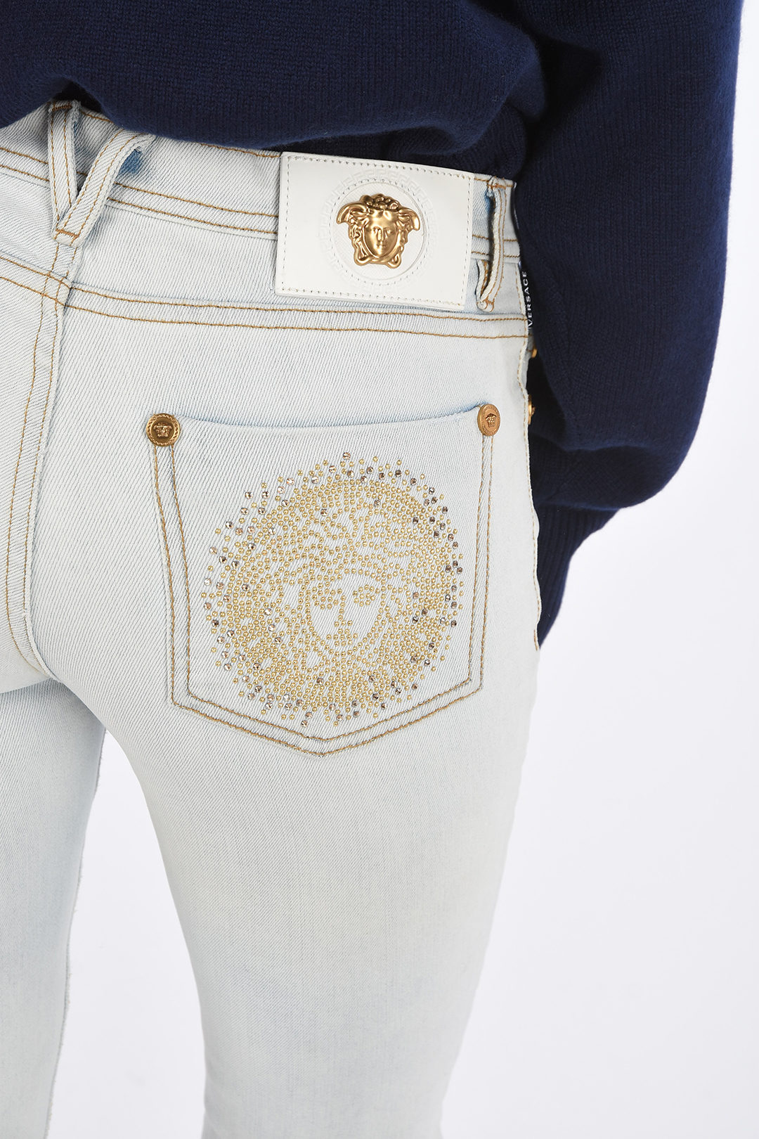 Versace stretch denim jeans with rhinestone embellished detail women ...