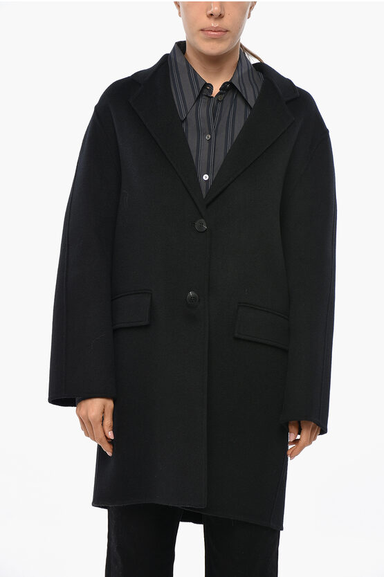 The Dynamis Studio Unlined Wool Coat With Flap Pockets In Black