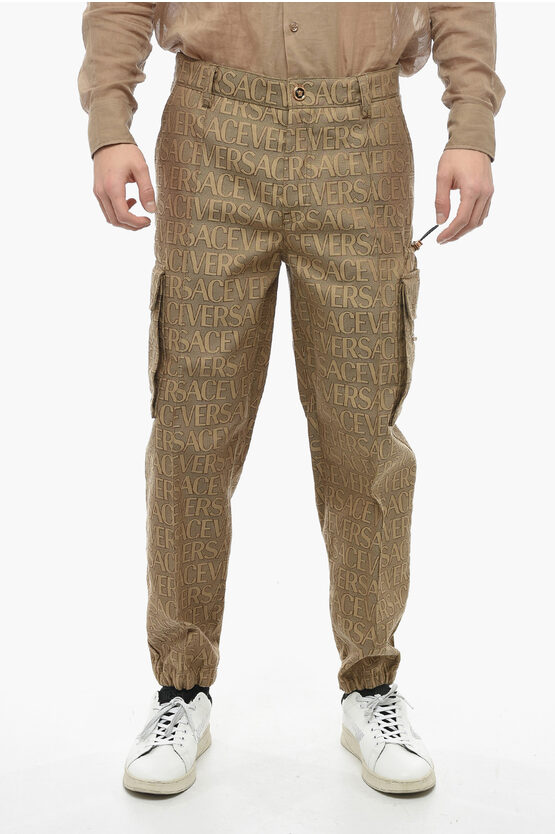 Shop Versace Utility Cargo Pants With All Over Logo Pattern