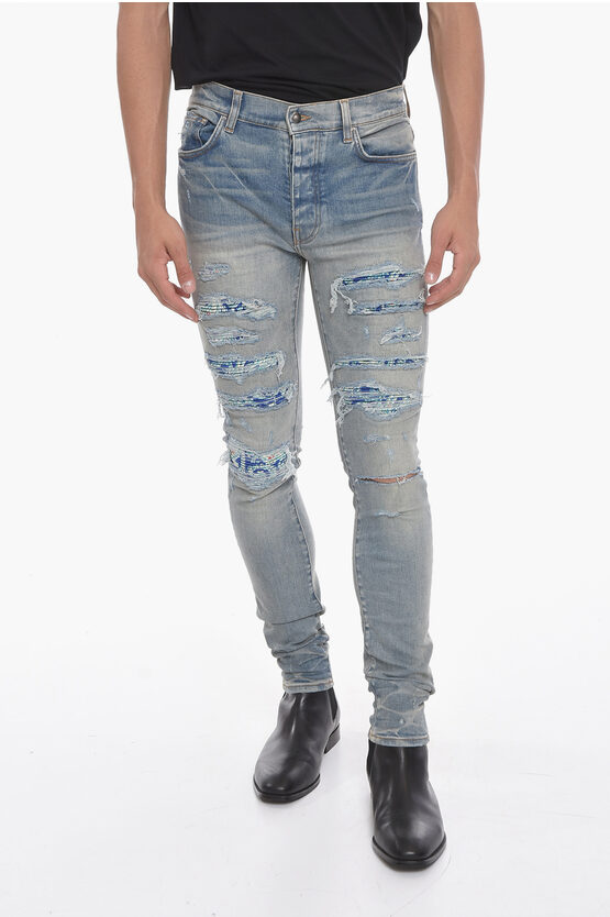 Amiri Vintage-effect Thrasher Skinny Denims With Patch Details 14c In Blue